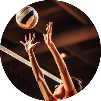 A woman's arms reaching up to the net to block a volleyball